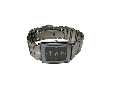 Lot 225 - 1990s Rado Jubilé wristwatch with diamond dot hour markers on a black rectangular dial, quartz movement