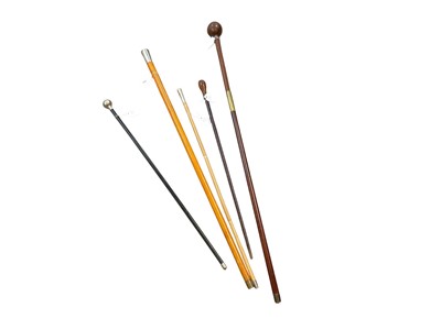 Lot 753 - Elizabeth II Royal Engineers walking cane, together with three swagger sticks and a walking cane in the form of a knob kerris (5).