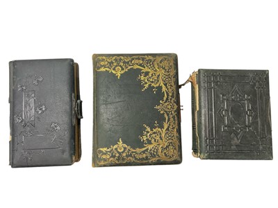 Lot 1552 - Three Victorian albums, one dated June 15th 1896 including Edwardian and Victorian portraits, the other two albums are empty, one dated 1869.