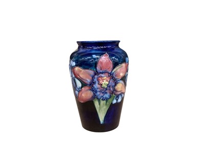 Lot 1266 - Moorcroft pottery vase decorated in the Orchid pattern