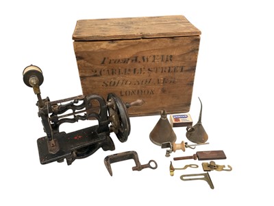 Lot 2484 - J.Weir sewing machine, circa 1870s, finished in black, the base of the sewing machine has a finely painted red and green pattern, the gears seem to be rotating smoothly, it comes in its original...