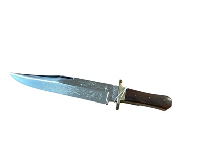 Lot 872 - Large Bowie knife by G Wostenholm & Son, Washington Works, Sheffield, with engraved flying eagle with star blade, clip back point with false edge and shaped brass cross guard, ricasso signed...