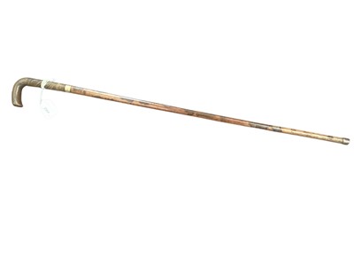 Lot 2564 - 19th century gentlemen’s walking cane with mottled Malacca shaft, carved rhinoceros horn handle and engraved gold collar. 81.5cm overall length.