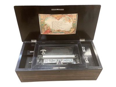 Lot 2547 - 19th century Swiss music box with eight airs, with paper label song sheet to underside on lid, in rosewood case with inlaid decoration, 49.5cm in length.