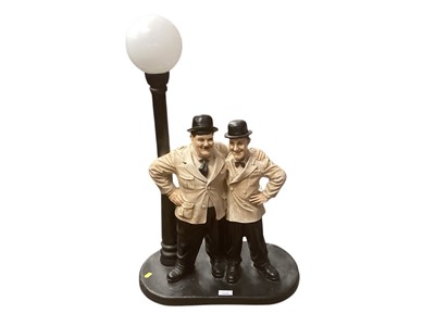 Lot 2549 - Novelty Laurel and Hardy themed table lamp, 73cm in overall height.