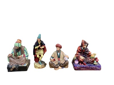 Lot 1231 - Four Royal Doulton figures - Cobbler HN1706, Omar Khayyam HN2247, The Potter HN1493 and The Pied Piper HN2102