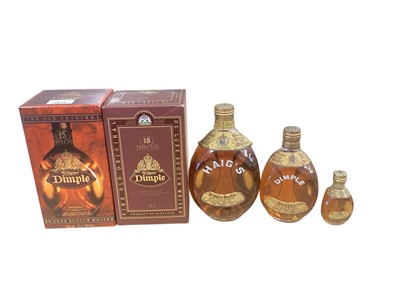 Lot 2612 - Dimple scotch whisky: three old bottles of graduated size, and two newer in boxes (5)