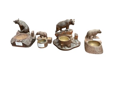 Lot 2486 - Four early to mid-20th century German Black Forest carved wooden bear smokers' companion ornaments, tallest 14cm (4)