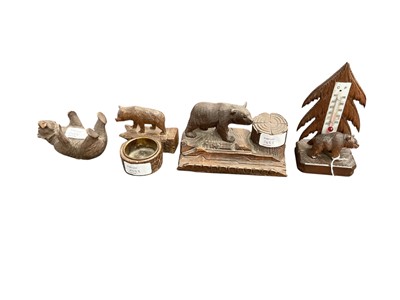 Lot 2488 - Four early to mid-20th century German Black Forest carved wooden bear novelty ornaments including bear thermometer, bear ashtray, bear inkwell and bear figure, tallest 14cm (4)