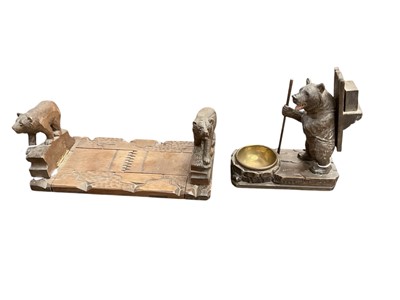 Lot 2489 - Early to mid-20th century German Black Forest carved wooden bear decorated adjustable book slide and bear smokers' companion (2)