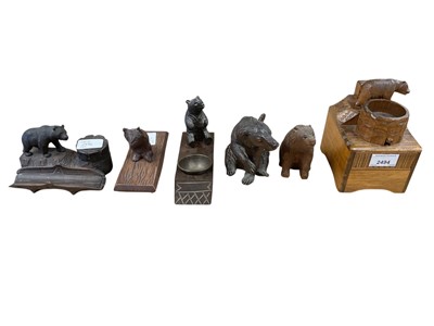 Lot 2494 - Six early-mid 20th century German Black Forest carved wooden novelty bear figures including inkwell, blotter, trinket box (6)