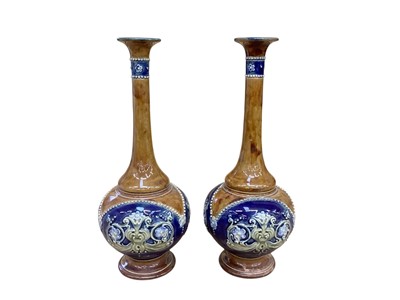 Lot 1247 - Pair of Royal Doulton slender neck stoneware vases, 29cm high