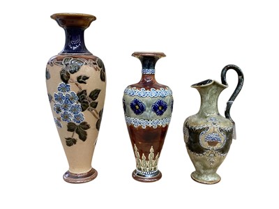 Lot 1248 - Two Royal Doulton stoneware vases together with a jug, tallest 32cm high (3)