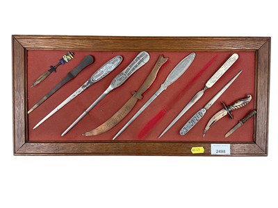 Lot 2498 - First World War Trench art, copper paper knife and lot novelty and advertising letter openers.