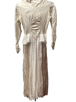 Lot 2140 - Three vintage wedding dresses, including 1950s satin and lace, 1980s Oyster satin, pointed waistline and rosettes on dropped shoulders by Berkertex, a cream satin dress with train, a heavily bea...