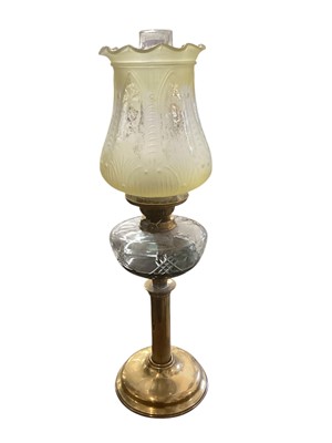 Lot 2505 - Late Victorian brass oil lamp with a cut glass reservoir and yellow tinted and etched glass shade decorated with cherub's approx 66cm high