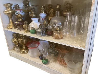 Lot 2506 - A collection of Victorian and later brass oil lamps and others including shades and sundry items
