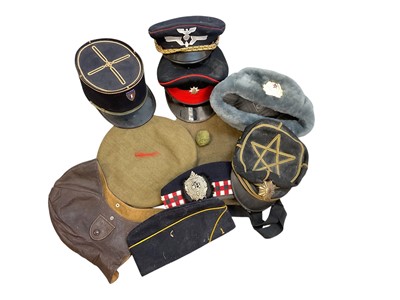 Lot 804 - Collection of British and European military hats and head gear to include Argyll and Sutherland Highlanders Glengarry cap, leather flying helmet and others (1 box).