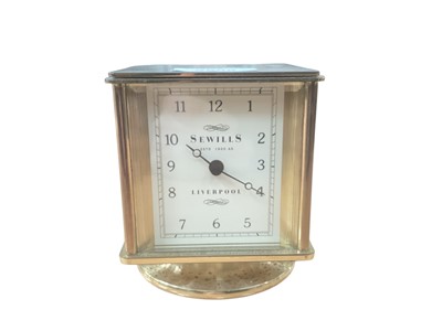 Lot 2508 - Combination desk clock, barometer, hygrometer and thermometer retailed by Sewill's, Liverpool with quartz movement in four sided glazed brass case 10.5cm high