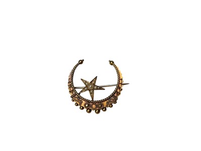 Lot 216 - Victorian 15ct gold and seed pearl star and crescent moon brooch with applied gold filigree decoration