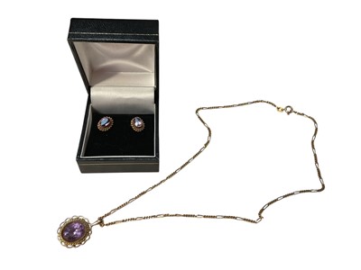 Lot 217 - Amethyst pendant and earrings, each with an oval mixed cut amethyst in 9ct gold setting