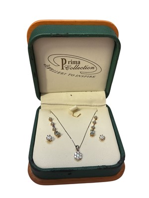 Lot 218 - Diamond cluster pendant with a flower shaped cluster of seven brilliant cut diamonds estimated to weigh approximately 0.25cts in total on 18ct white gold chain, together with a pair of similar e...