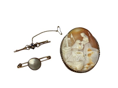 Lot 219 - Edwardian 9ct gold sapphire and seed pearl bar brooch, an antique Italian carved shell cameo brooch in yellow metal mount and one other brooch