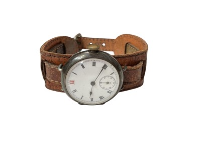 Lot 226 - First World War gentleman's silver trench watch with white enamel dial on a leather strap