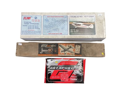 Lot 2594 - Flair Cub model aircraft kit, together with a Keil Kraft Kits petrol plane, and a radio control system (3)
