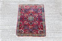Lot 1781 - Small Eastern rug - with claret field centred...