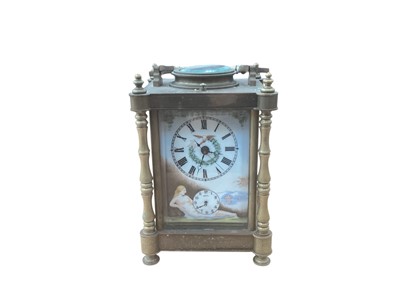 Lot 2596 - 20th century brass carriage clock, with three hand painted porcelain panels depicting nude women. 17cm in overall height.