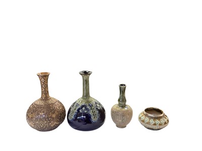 Lot 1300 - Three Doulton stoneware vases, together with another small pot with silver rim (4)