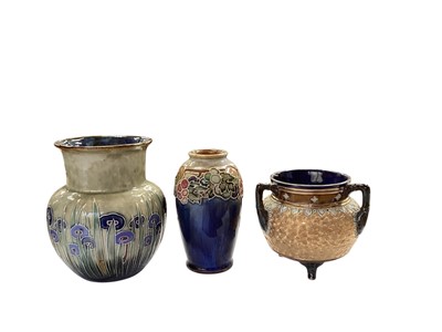 Lot 1304 - Two Royal Doulton stoneware vases, together with another three handled pot (3)