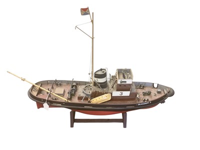Lot 2561 - Two model boats including a tug, the largest 102cm long