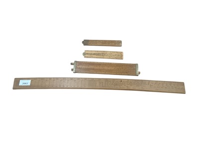 Lot 2663 - 19th century brass mounted slide rule by Dring and Fage, three similar rules
