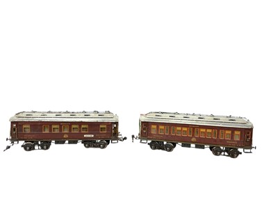 Lot 2723 - A pair of Märklin gauge 1 bogie 'Mitropa' Sleeping car, 1919-1929, finished in teak livery with orange lining, no 1932 and no 1933, to include other rolling stock and track