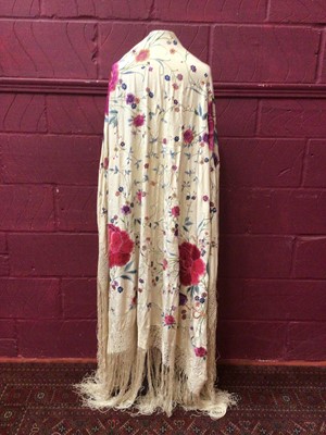 Lot 2145 - Fine quality Chinese silk shawl, embroidered flowers in poly-chrome silk thread, deep knotted fringing. 130 x130 cms approximately not including the fringe)