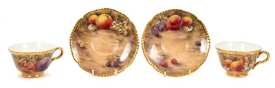 Lot 101 - Pair of Royal Worcester cabinet cups and saucers, dated 1954/55, painted with fruit, signed P. Love, the saucers 15cm diameter