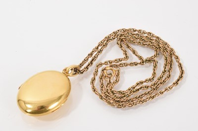 Lot 537 - 19th century French gold oval locket on a yellow metal rope twist chain