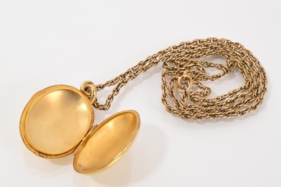 Lot 537 - 19th century French gold oval locket on a yellow metal rope twist chain