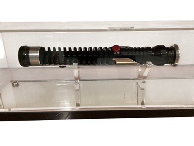 Lot 5 - Star Wars Qui-Gon Jinn lightsaber hilt, in display case (1) Please note: Lot 5 description has been changed.