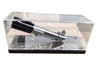 Lot 8 - Star Wars lightsaber hilt, marked GRAFLEX, in display case (1)