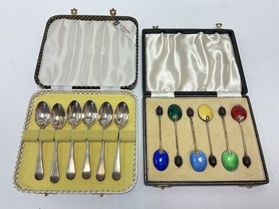 Lot 79 - Set of six silver gilt and enamel bean end coffee spoons and one other set of six silver teaspoons, both in fitted cases