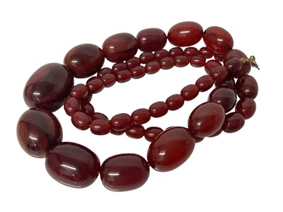 Lot 647 - Vintage simulated cherry amber bead necklace