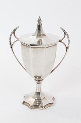 Lot 191 - George V silver cup and cover of octagonal form, with twin leaf mounted handles and octagonal slip in cover, on a star shaped, octagonal base (Sheffield 1926), Stevenson & Law, all at approx...