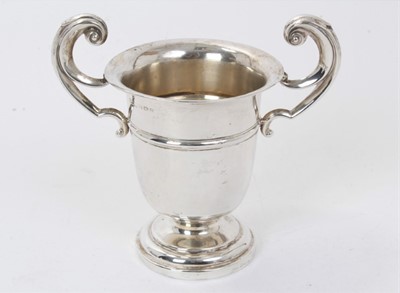 Lot 190 - 1920s silver two handled cup, with a flared rim and twin scroll handles, on a circular pedestal base (Birmingham 1926), Henry Williamson Ltd, all at approximately 3ozs, 13cm overall height