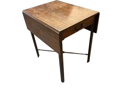 Lot 1546 - George III mahogany Pembroke table, in the manner of Chippendale, with drop leaf top and frieze drawer on internally chamfered supports and castors, united by an X-stretcher
