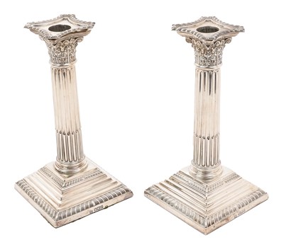Lot 254 - Pair of silver Corinthian column candlesticks