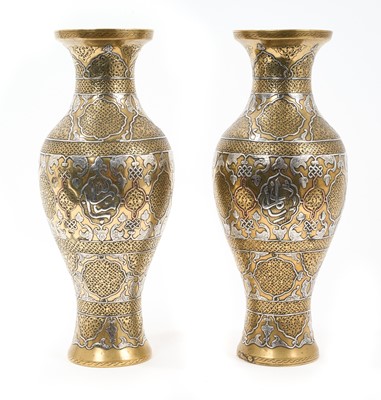 Lot 837 - Pair of good quality Mamluk-style brass, vases with white metal and copper inlay