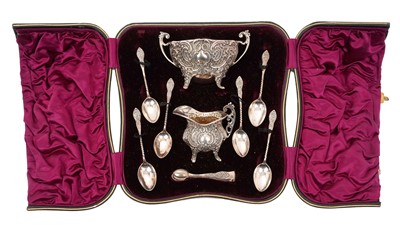 Lot 260 - Late Victorian silver sugar and cream set, with scroll and latticework decoration
